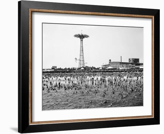 Bathers Enjoying Coney Island Beaches. Parachute Ride and Steeplechase Park Visible in the Rear-Margaret Bourke-White-Framed Photographic Print