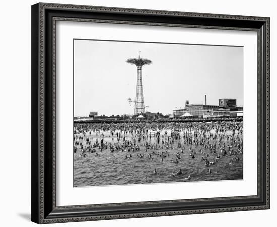 Bathers Enjoying Coney Island Beaches. Parachute Ride and Steeplechase Park Visible in the Rear-Margaret Bourke-White-Framed Photographic Print