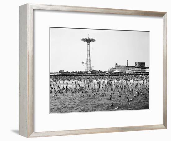 Bathers Enjoying Coney Island Beaches. Parachute Ride and Steeplechase Park Visible in the Rear-Margaret Bourke-White-Framed Photographic Print