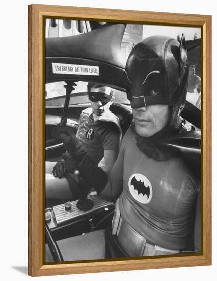 Batman Adam West and "Robin" Burt Ward in Bat Mobile, on Set During Shooting of Scene-Yale Joel-Framed Premier Image Canvas