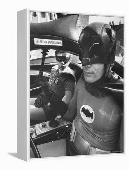 Batman Adam West and "Robin" Burt Ward in Bat Mobile, on Set During Shooting of Scene-Yale Joel-Framed Premier Image Canvas