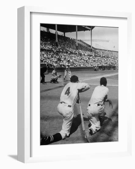 Batter Getting Ready for Pitch While Other Players are Waiting their Turn to Bat-Allan Grant-Framed Photographic Print