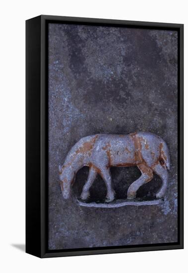 Battered Lead Model of Grazing Horse Lying on Tarnished Metal-Den Reader-Framed Premier Image Canvas