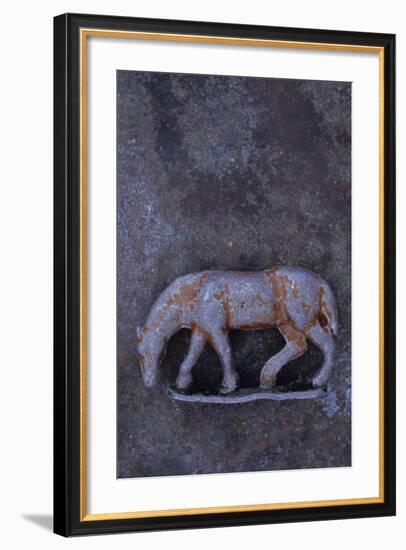 Battered Lead Model of Grazing Horse Lying on Tarnished Metal-Den Reader-Framed Photographic Print