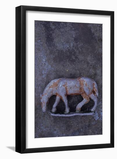 Battered Lead Model of Grazing Horse Lying on Tarnished Metal-Den Reader-Framed Photographic Print