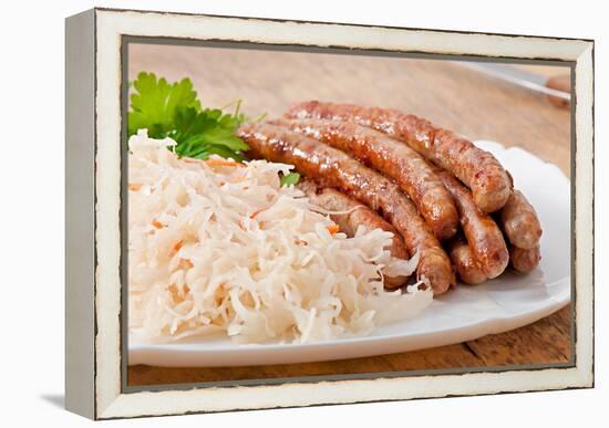 Bavarian Fried Sausages on Sauerkraut-Timolina-Framed Premier Image Canvas