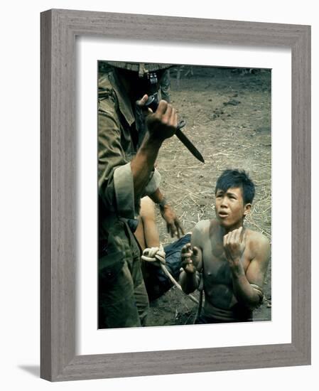 Bayonet Wielding South Vietnamese Soldier Menacing Captured Viet Cong Suspect During Interrogation-Larry Burrows-Framed Photographic Print