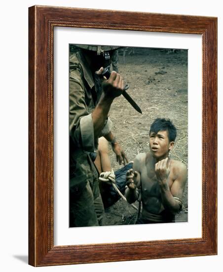 Bayonet Wielding South Vietnamese Soldier Menacing Captured Viet Cong Suspect During Interrogation-Larry Burrows-Framed Photographic Print