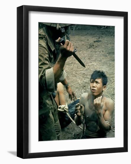 Bayonet Wielding South Vietnamese Soldier Menacing Captured Viet Cong Suspect During Interrogation-Larry Burrows-Framed Photographic Print