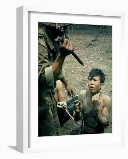 Bayonet Wielding South Vietnamese Soldier Menacing Captured Viet Cong Suspect During Interrogation-Larry Burrows-Framed Photographic Print