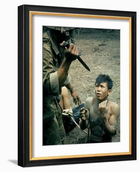 Bayonet Wielding South Vietnamese Soldier Menacing Captured Viet Cong Suspect During Interrogation-Larry Burrows-Framed Photographic Print