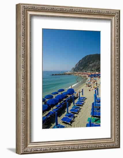 Beach umbrellas lining the beach in Monterosso al Mare, Cinque Terre, Italy.-Michael DeFreitas-Framed Photographic Print