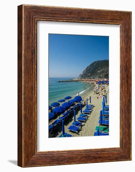 Beach umbrellas lining the beach in Monterosso al Mare, Cinque Terre, Italy.-Michael DeFreitas-Framed Photographic Print