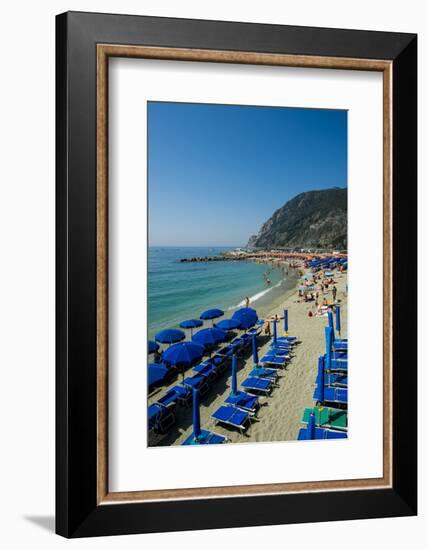 Beach umbrellas lining the beach in Monterosso al Mare, Cinque Terre, Italy.-Michael DeFreitas-Framed Photographic Print