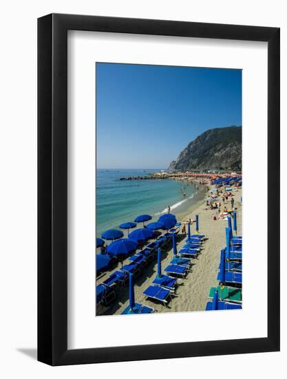 Beach umbrellas lining the beach in Monterosso al Mare, Cinque Terre, Italy.-Michael DeFreitas-Framed Photographic Print