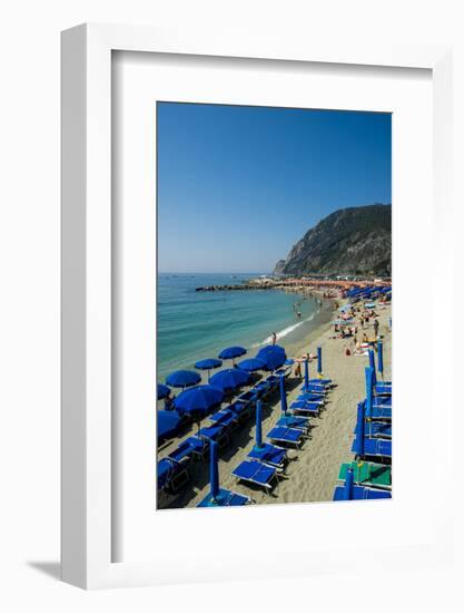 Beach umbrellas lining the beach in Monterosso al Mare, Cinque Terre, Italy.-Michael DeFreitas-Framed Photographic Print