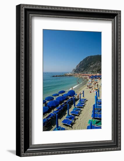 Beach umbrellas lining the beach in Monterosso al Mare, Cinque Terre, Italy.-Michael DeFreitas-Framed Photographic Print