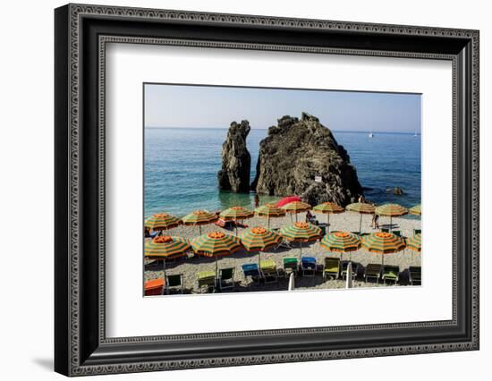 Beach umbrellas lining the beach in Monterosso al Mare, Cinque Terre, Italy.-Michael DeFreitas-Framed Photographic Print