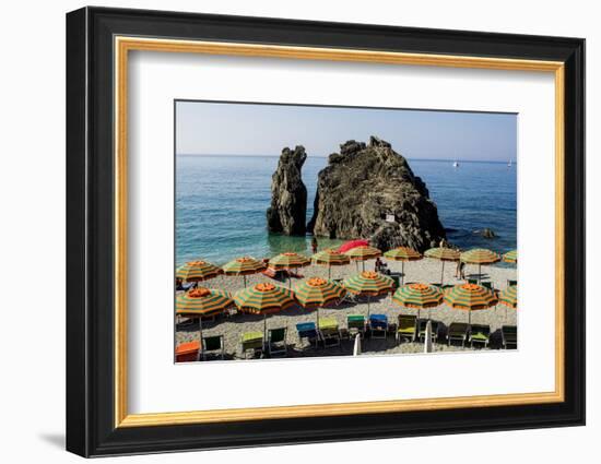 Beach umbrellas lining the beach in Monterosso al Mare, Cinque Terre, Italy.-Michael DeFreitas-Framed Photographic Print