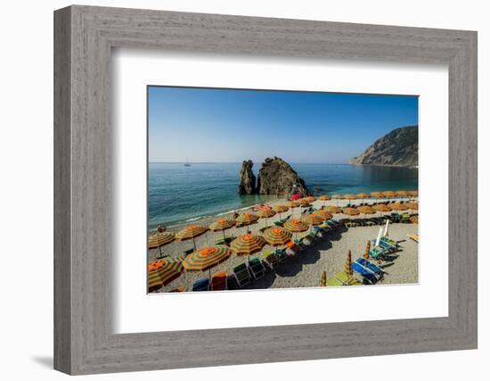 Beach umbrellas lining the beach in Monterosso al Mare, Cinque Terre, Italy.-Michael DeFreitas-Framed Photographic Print