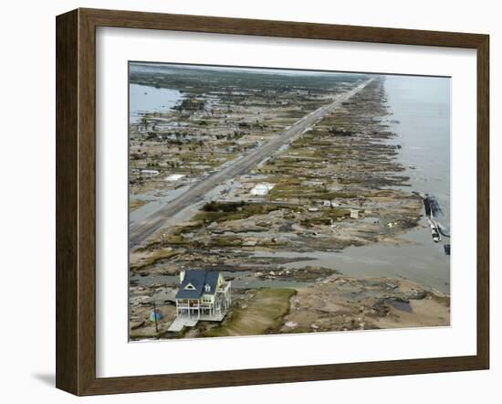 Beachfront Home Stands Among the Debris in Gilchrist, Texas after Hurricane Ike Hit the Area-null-Framed Photographic Print