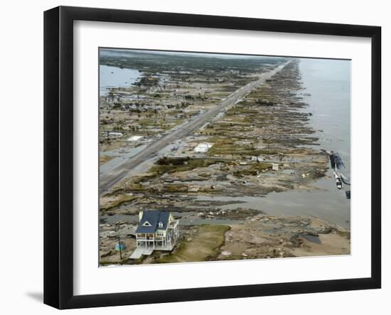 Beachfront Home Stands Among the Debris in Gilchrist, Texas after Hurricane Ike Hit the Area-null-Framed Photographic Print