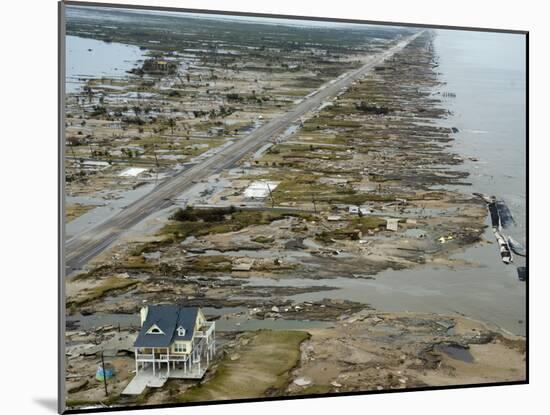 Beachfront Home Stands Among the Debris in Gilchrist, Texas after Hurricane Ike Hit the Area-null-Mounted Photographic Print