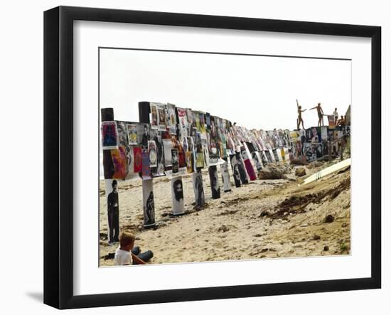 Beachgoers Climb on a Display of Posters, Montauk Point, Long Island, New York, 1967-Henry Groskinsky-Framed Photographic Print