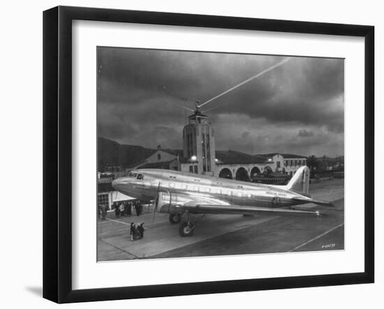 Beacon Shining Forth at Evening from Air Terminal Tower, American Airlines Plane in Foreground-null-Framed Premium Photographic Print