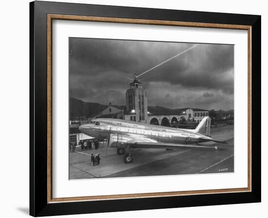 Beacon Shining Forth at Evening from Air Terminal Tower, American Airlines Plane in Foreground-null-Framed Photographic Print