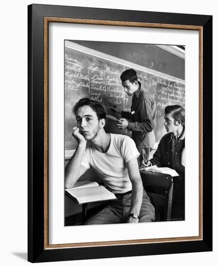 Beard Started on Teenage High School Student as Others Work on Lessons at blackboard and desk-Alfred Eisenstaedt-Framed Photographic Print