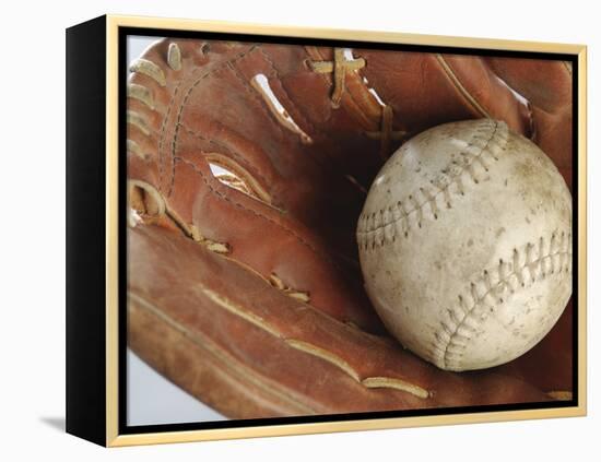 Beaten-Up Baseball in Baseball Glove-null-Framed Premier Image Canvas