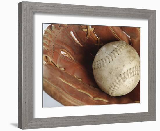 Beaten-Up Baseball in Baseball Glove-null-Framed Photographic Print