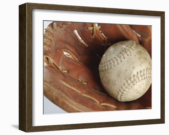 Beaten-Up Baseball in Baseball Glove-null-Framed Photographic Print