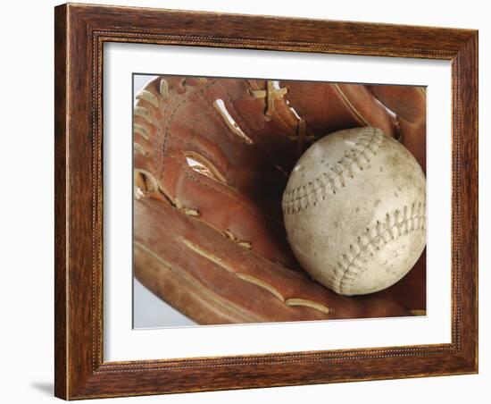 Beaten-Up Baseball in Baseball Glove-null-Framed Photographic Print