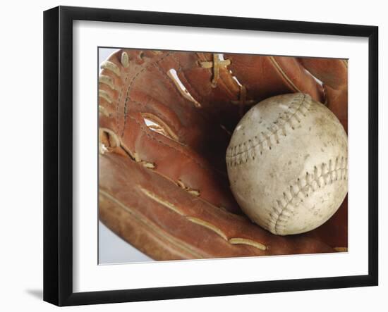 Beaten-Up Baseball in Baseball Glove-null-Framed Photographic Print