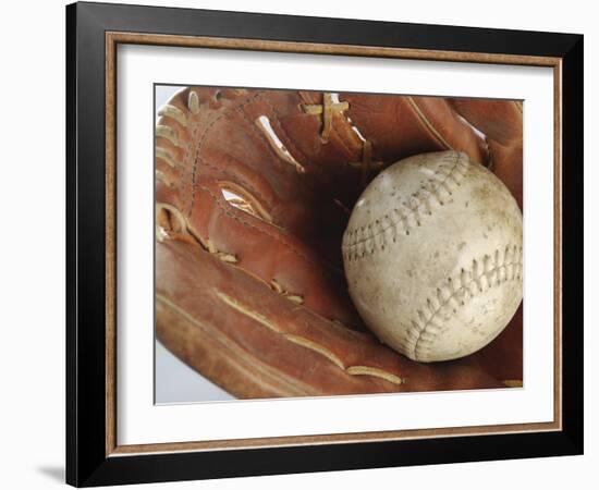 Beaten-Up Baseball in Baseball Glove-null-Framed Photographic Print