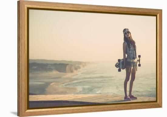 Beautiful And Fashion Young Woman Posing With A Skateboard-iko-Framed Stretched Canvas