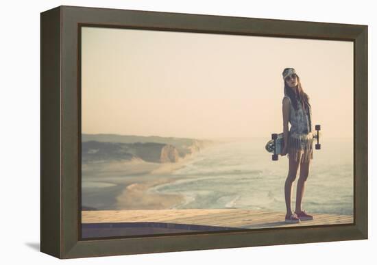 Beautiful And Fashion Young Woman Posing With A Skateboard-iko-Framed Stretched Canvas