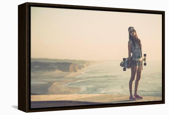 Beautiful And Fashion Young Woman Posing With A Skateboard-iko-Framed Stretched Canvas