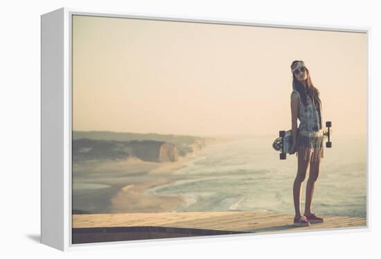 Beautiful And Fashion Young Woman Posing With A Skateboard-iko-Framed Stretched Canvas