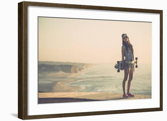 Beautiful And Fashion Young Woman Posing With A Skateboard-iko-Framed Art Print