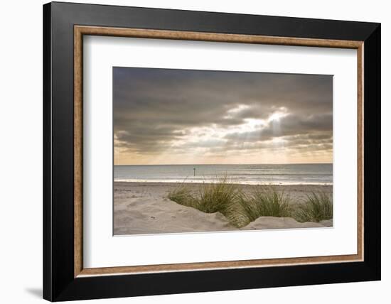 Beautiful Inspirational Sunset over English Coastal Landscape with Sun Bemsn Penetrating Moody Clou-Veneratio-Framed Photographic Print