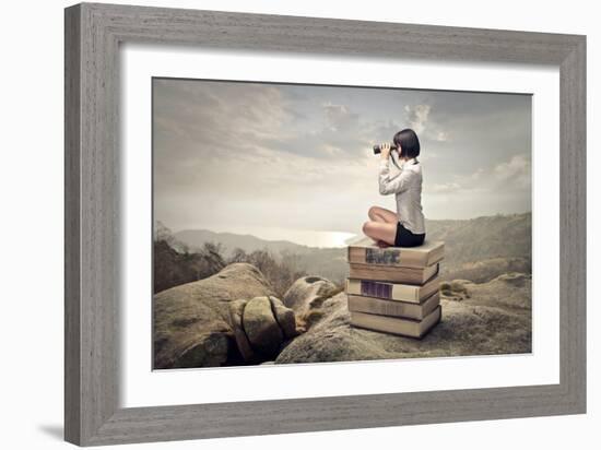 Beautiful Woman Sitting On A Pile Of Old Books Watching With Binoculars-olly2-Framed Premium Giclee Print