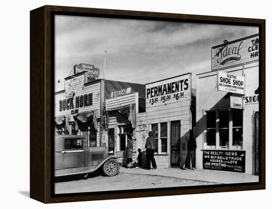 Beauty Parlor Advertising: Permanents: $3.50, $5.00 and $6.50, Shack Town, Fort Peck Dam-Margaret Bourke-White-Framed Premier Image Canvas