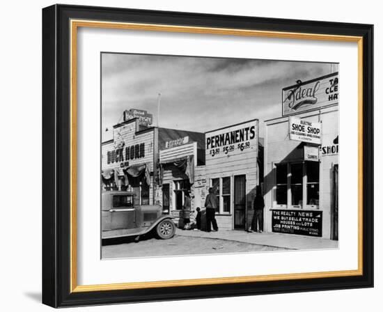 Beauty Parlor Advertising: Permanents: $3.50, $5.00 and $6.50, Shack Town, Fort Peck Dam-Margaret Bourke-White-Framed Photographic Print