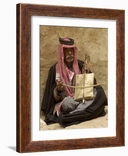 Bedouin Man in Traditional Dress Playing a Musical Instrument, Beida, Jordan, Middle East-Sergio Pitamitz-Framed Photographic Print