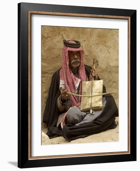 Bedouin Man in Traditional Dress Playing a Musical Instrument, Beida, Jordan, Middle East-Sergio Pitamitz-Framed Photographic Print