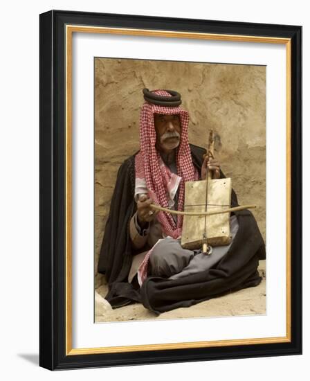 Bedouin Man in Traditional Dress Playing a Musical Instrument, Beida, Jordan, Middle East-Sergio Pitamitz-Framed Photographic Print