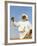 Bedouin Man Kneels on Top of a Sand Dune in the Desert-John Warburton-lee-Framed Photographic Print